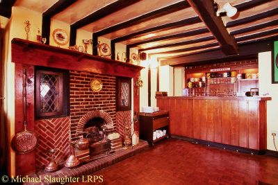 Bar and Fireplace.  by Michael Slaughter. Published on  