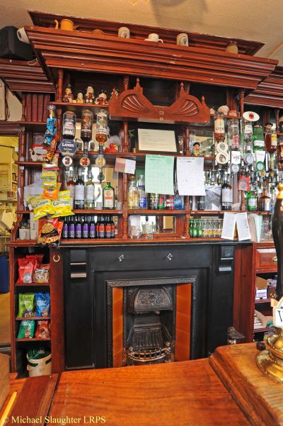Fireplace Behind Bar.  by Michael Slaughter. Published on 